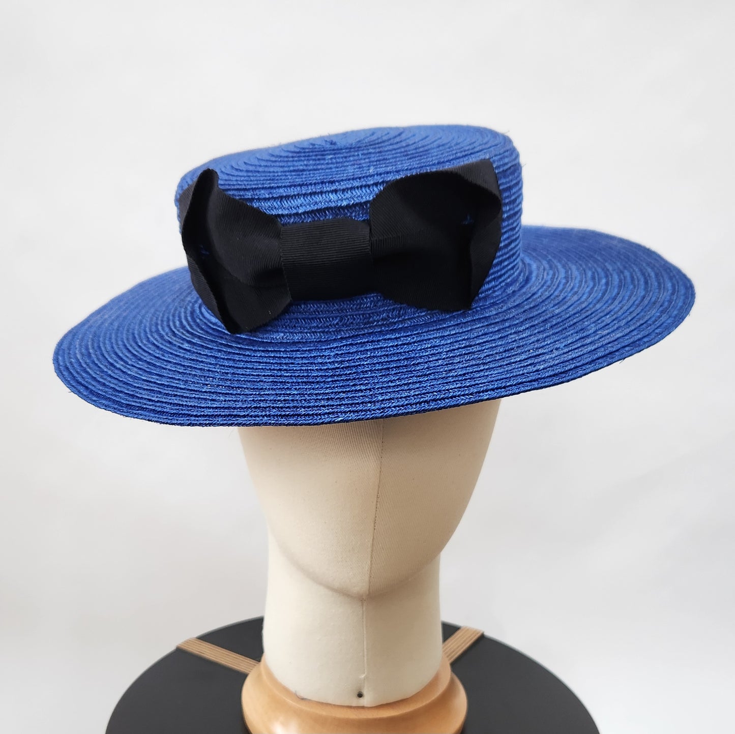 Colette Boater Hat in Blue Stitched Braid with black petersham infinity bow
