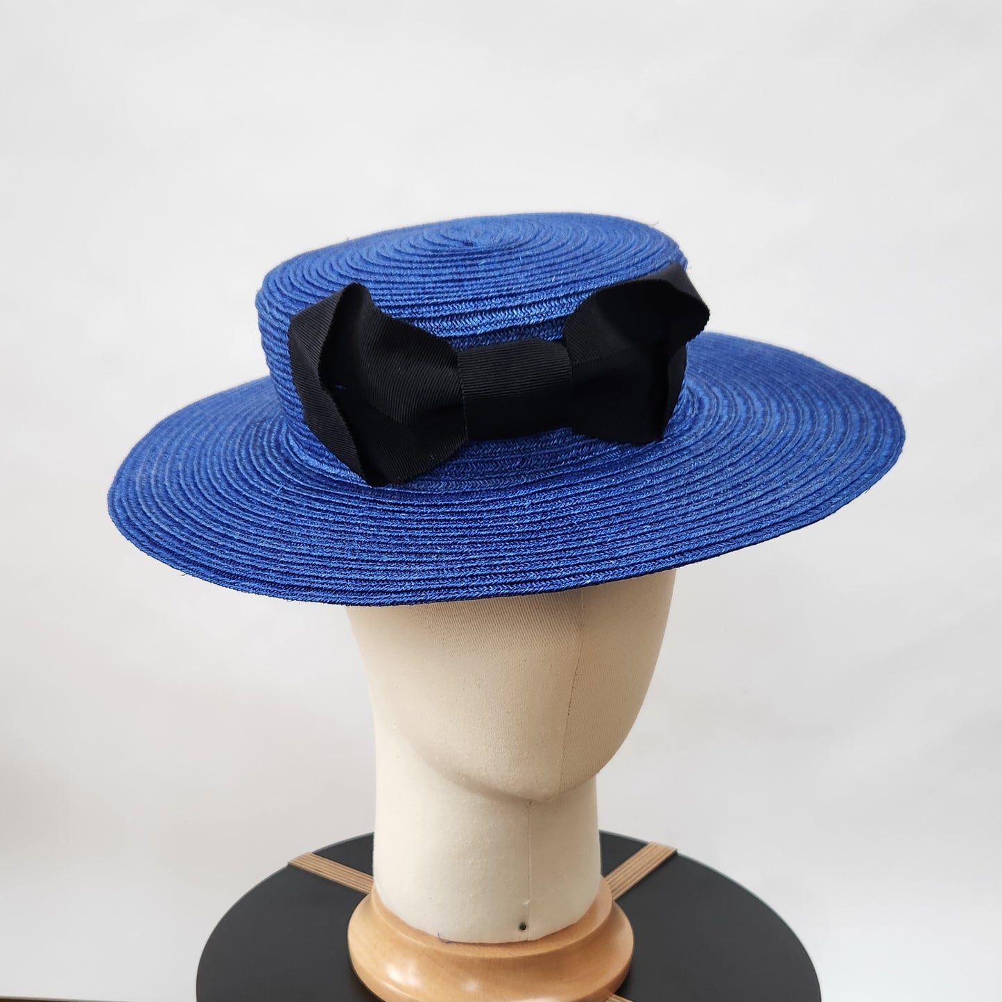 Colette Boater Hat in Blue Stitched Braid with black petersham infinity bow