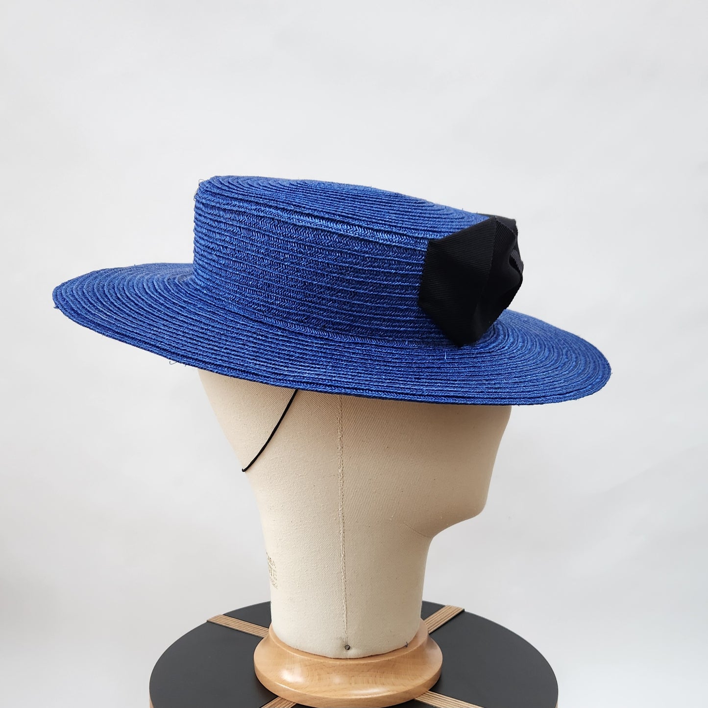 Colette Boater Hat in Blue Stitched Braid with black petersham infinity bow
