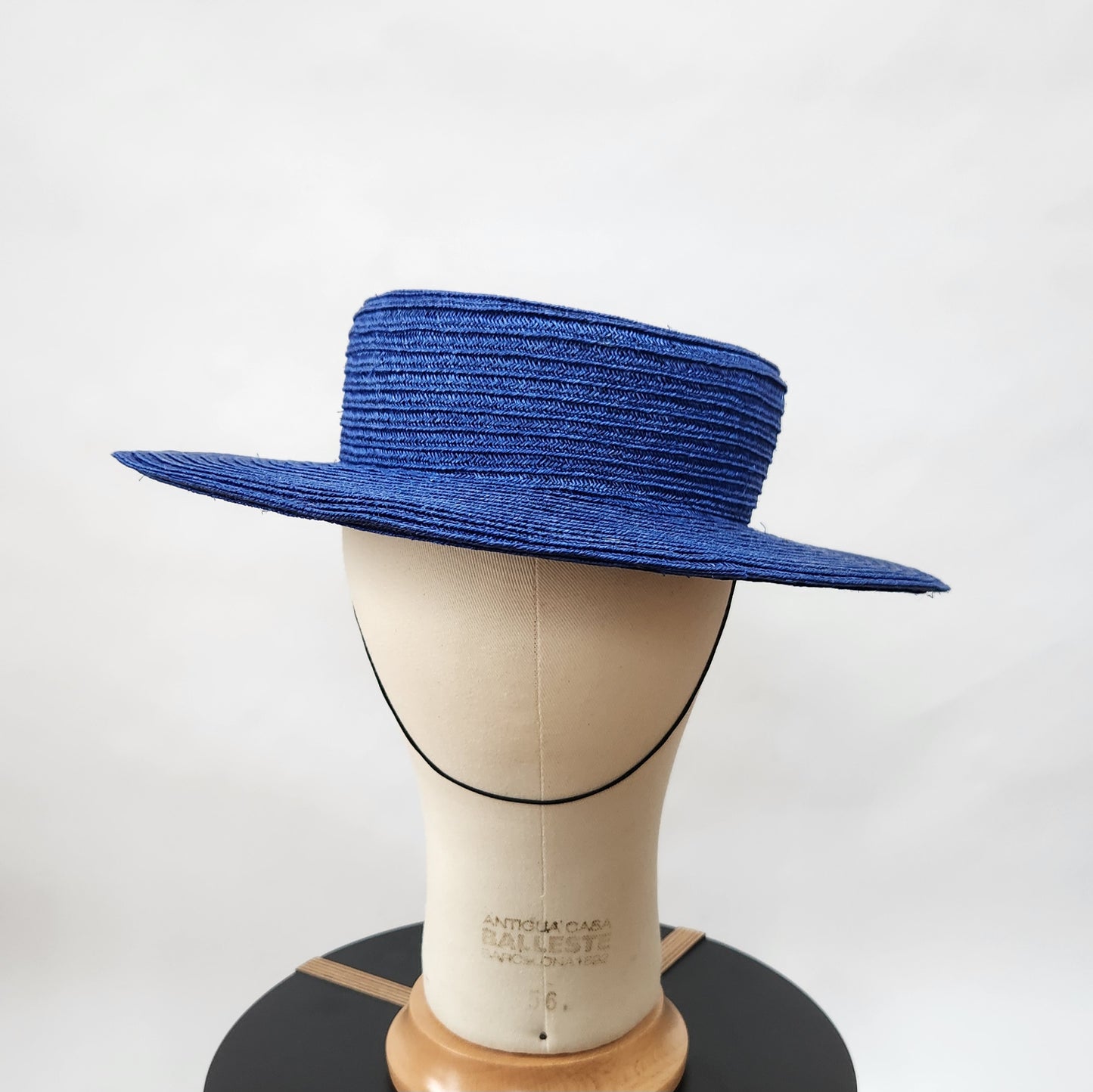 Colette Boater Hat in Blue Stitched Braid with black petersham infinity bow
