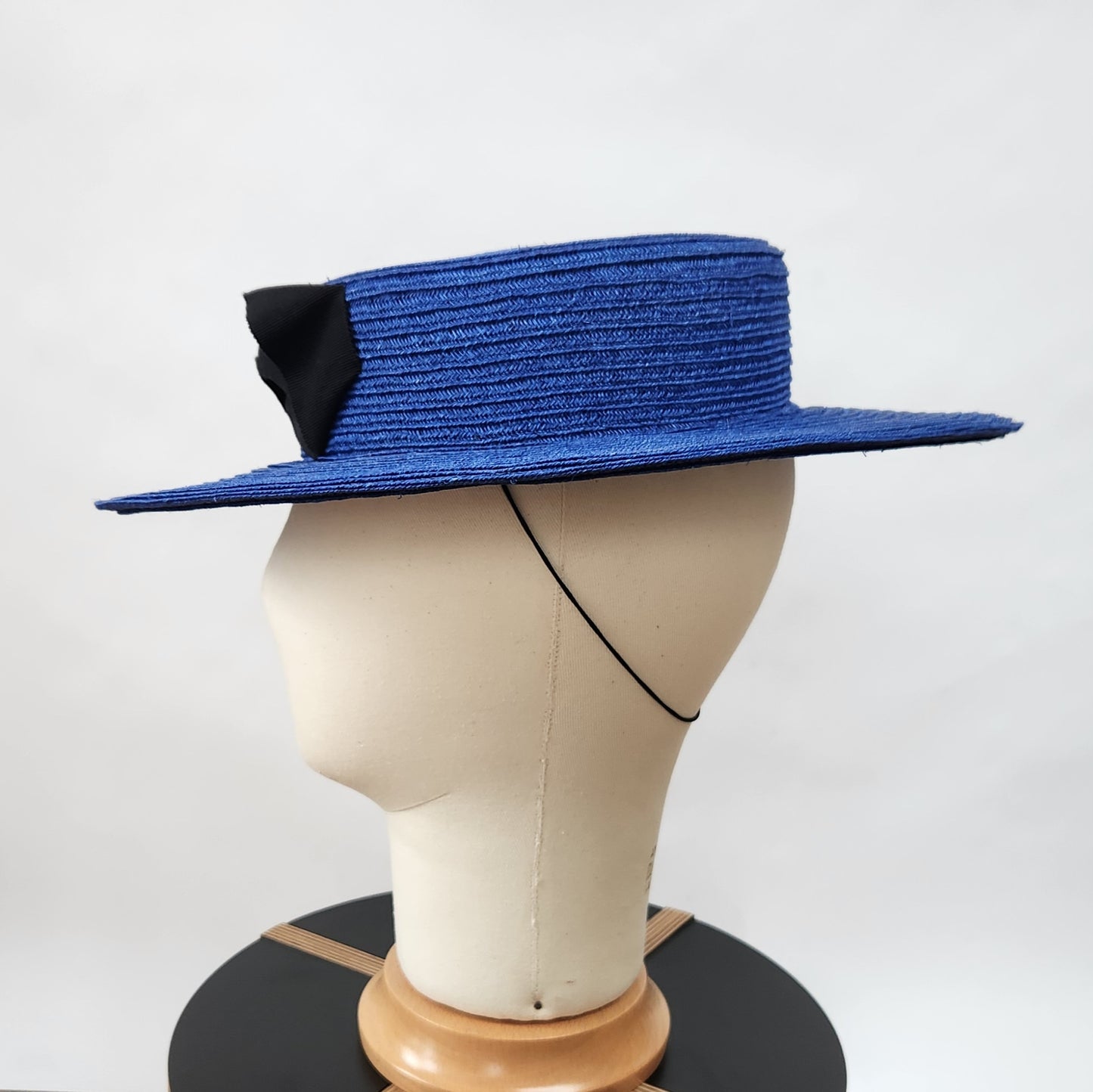Colette Boater Hat in Blue Stitched Braid with black petersham infinity bow