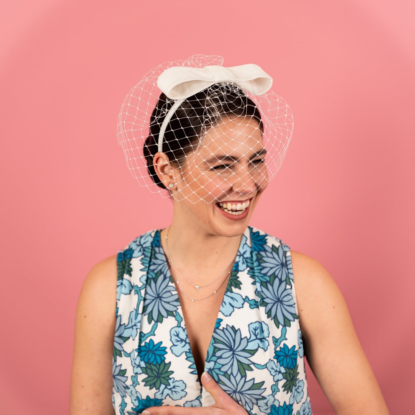 Abbey Headband with white birdcage veil with velvet bow in white