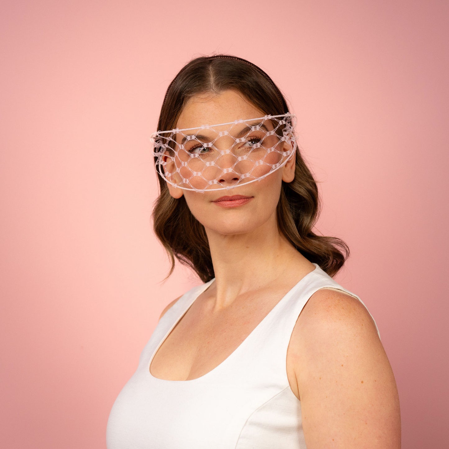 Jessica face veil on headband in pale pink Spring Racewear Headpiece