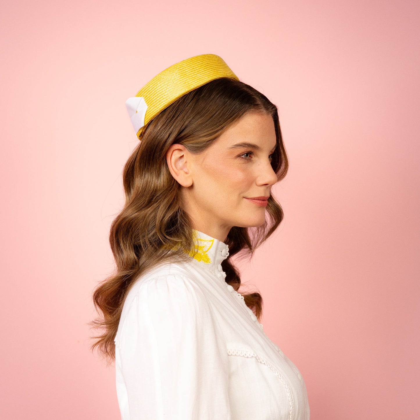 Peggy Pillbox in yellow straw with white petersham infinity bow Spring Racing Headpiece