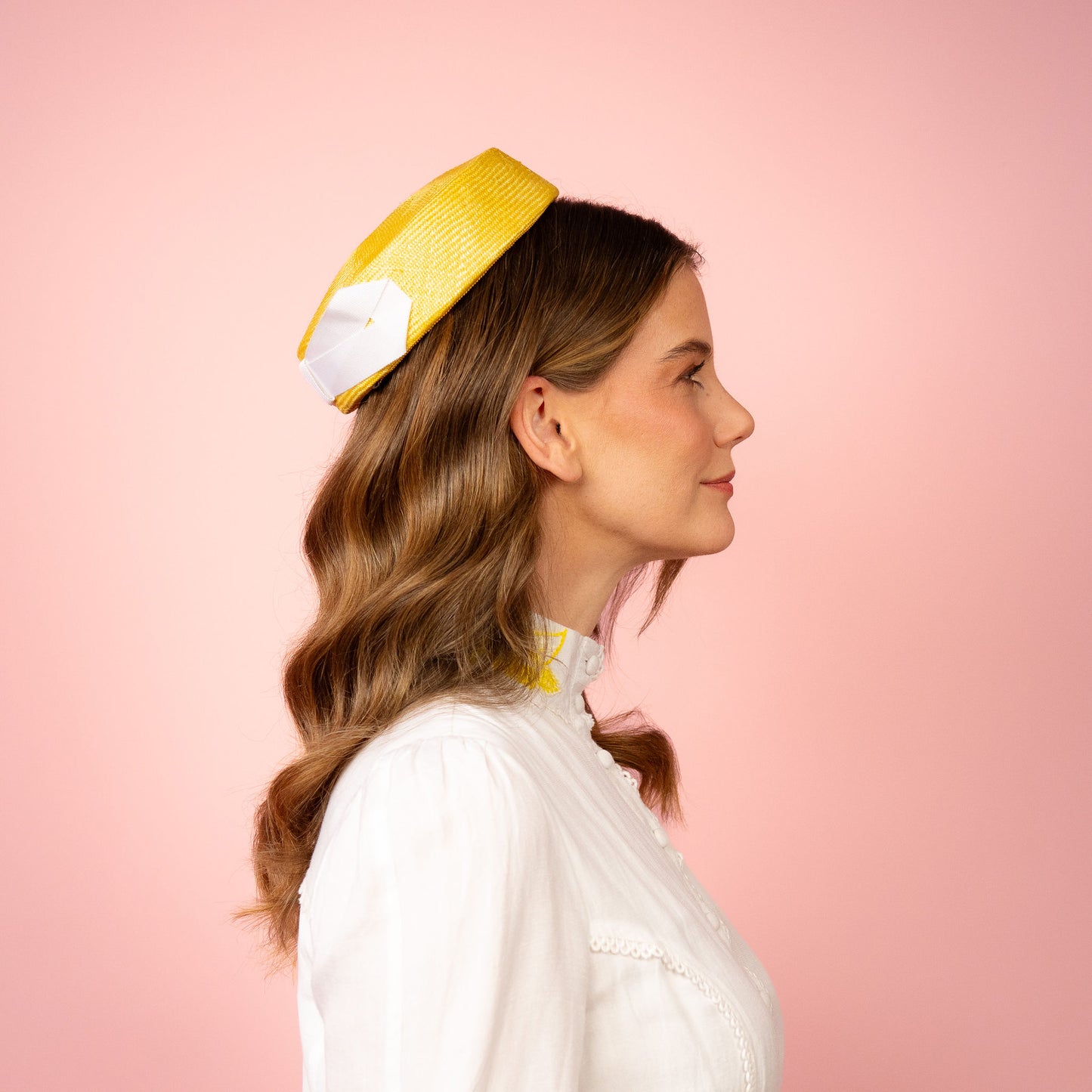 Peggy Pillbox in yellow straw with white petersham infinity bow Spring Racing Headpiece