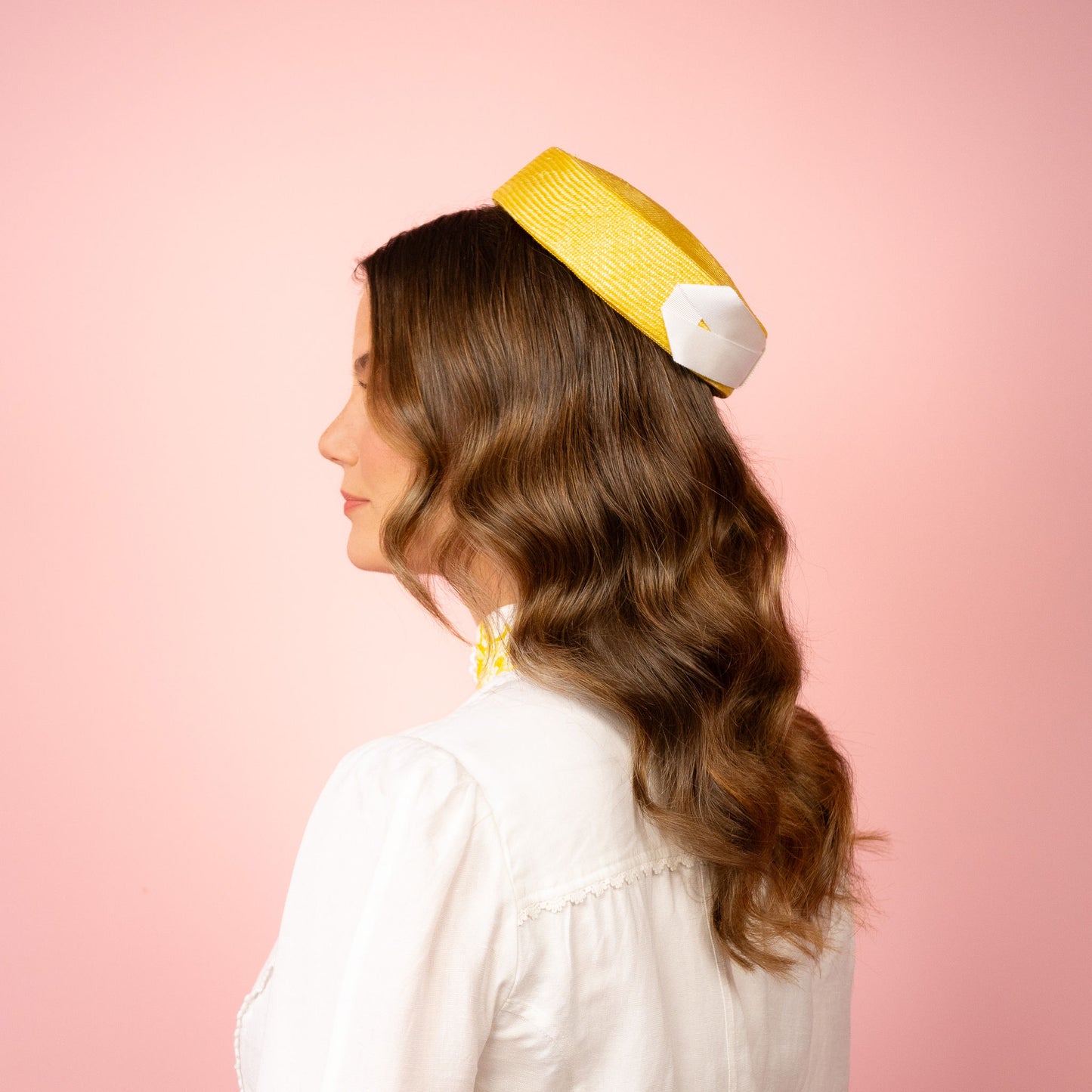 Peggy Pillbox in yellow straw with white petersham infinity bow Spring Racing Headpiece