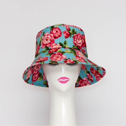 The Appin Bucket Hat in floral has a square shape crown with tip and side band.  The flared brim is 8cm wide to protect you from the sun.  Created by Melbourne based Lauren J Ritchie Millinery.