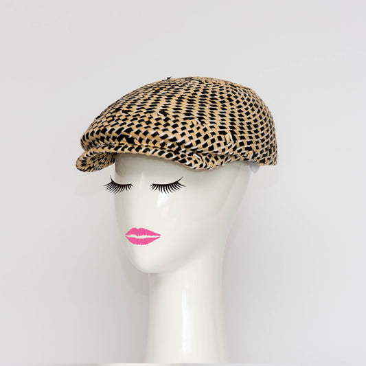 The Egan Cap is a modern all in one blocked cap.  The hat is made in a woven straw which provides a textured finish and variation in fibres.  Created by Melbourne based Lauren J Ritchie Millinery.