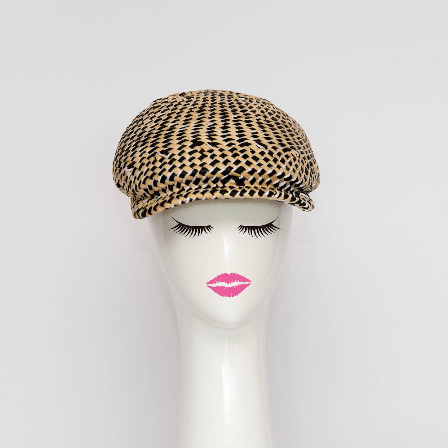 The Egan Cap is a modern all in one blocked cap. The hat is made in a woven straw which provides a textured finish and variation in fibres. Created by Melbourne based Lauren J Ritchie Millinery.