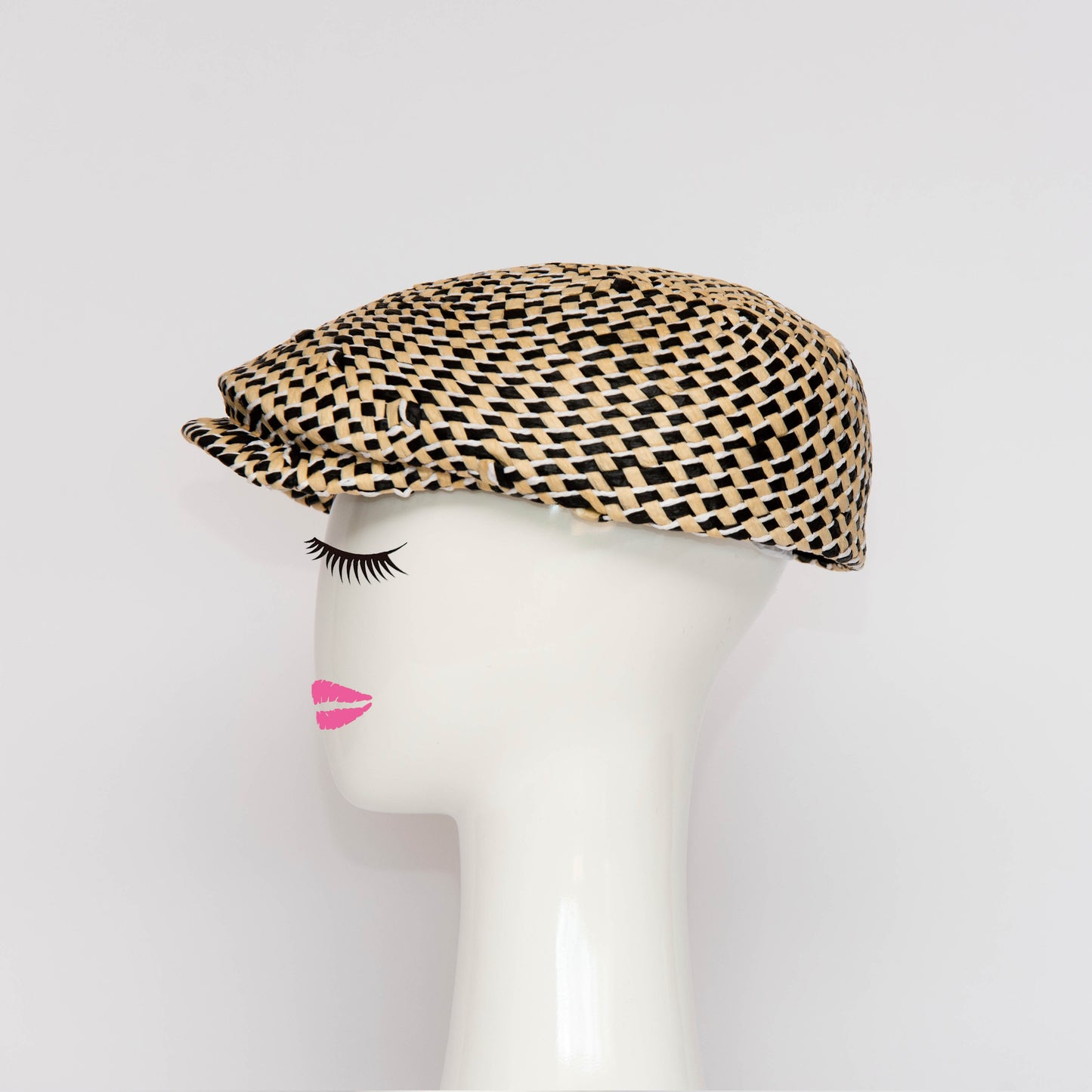 A side view of the Egan Cap is a modern all in one blocked cap. Created by Melbourne based Lauren J Ritchie Millinery.