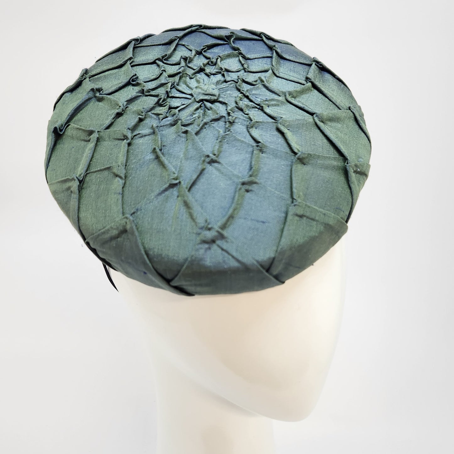 Green pleated silk button beret