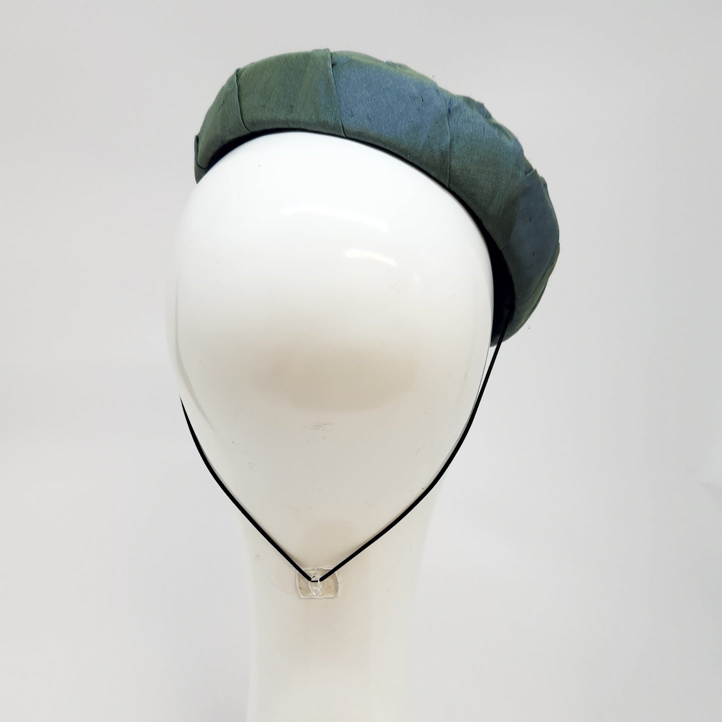 Green pleated silk button beret