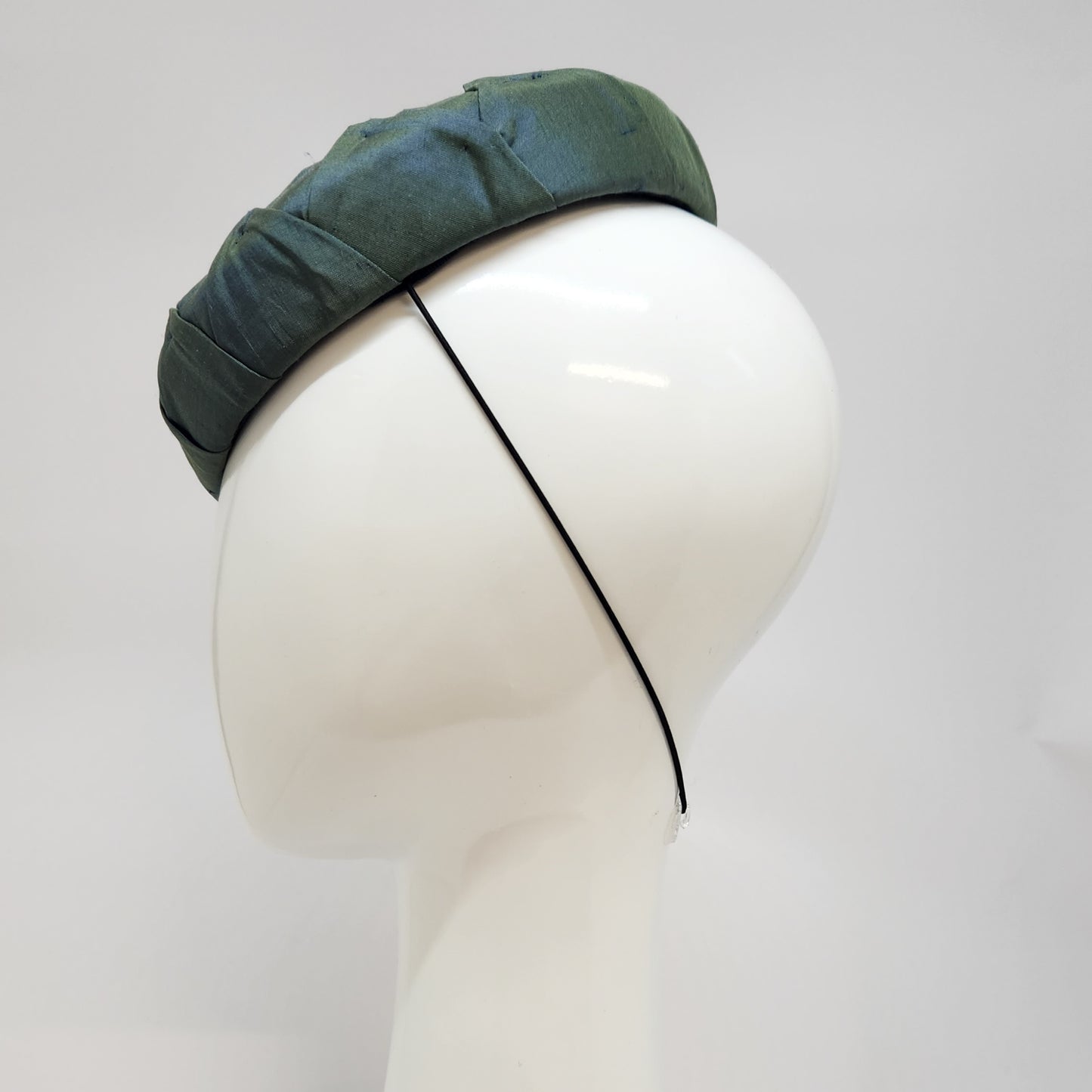 Green pleated silk button beret