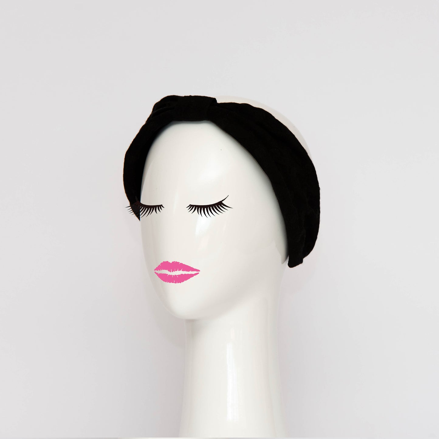 The Georgie Headband is a hand draped shape that is cinched with a centre wrap. The headpiece is created by Melbourne based Lauren J Ritchie Millinery.