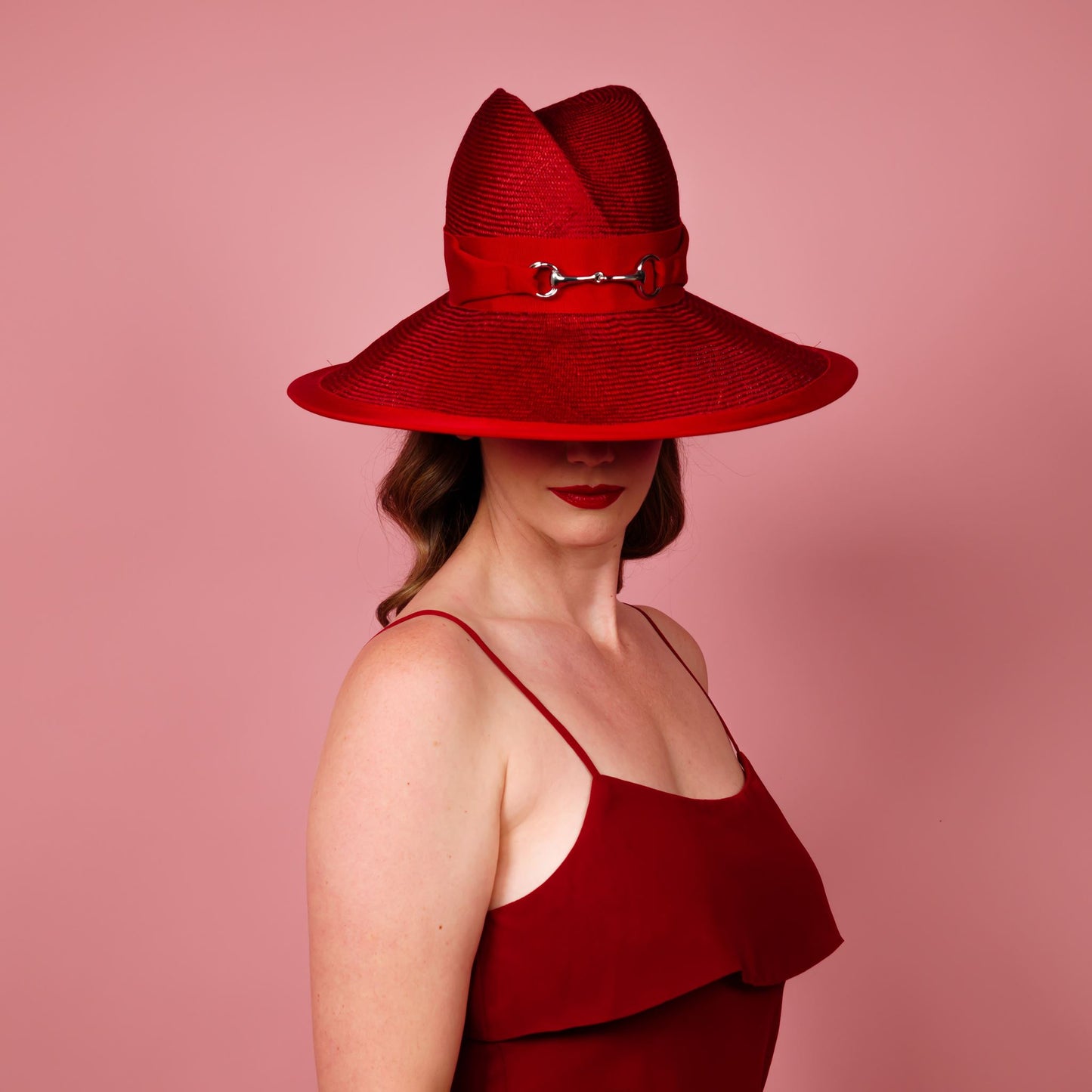 Charlotte wide brimmed hat with shaped crown in red straw and silver buckle