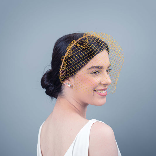 All of Me bridal birdcage veil on headband in gold veiling