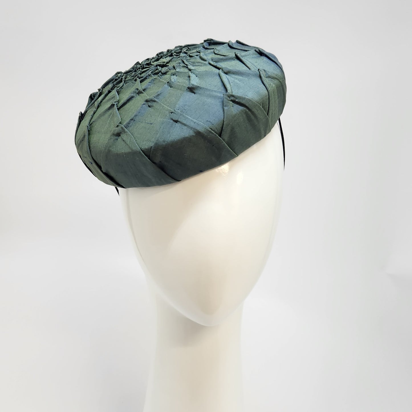 Green pleated silk button beret