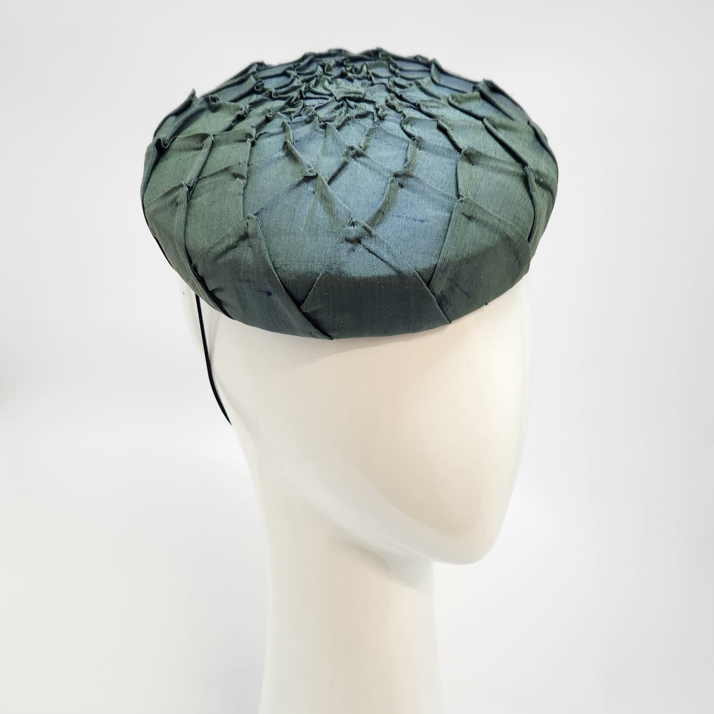 Green pleated silk button beret